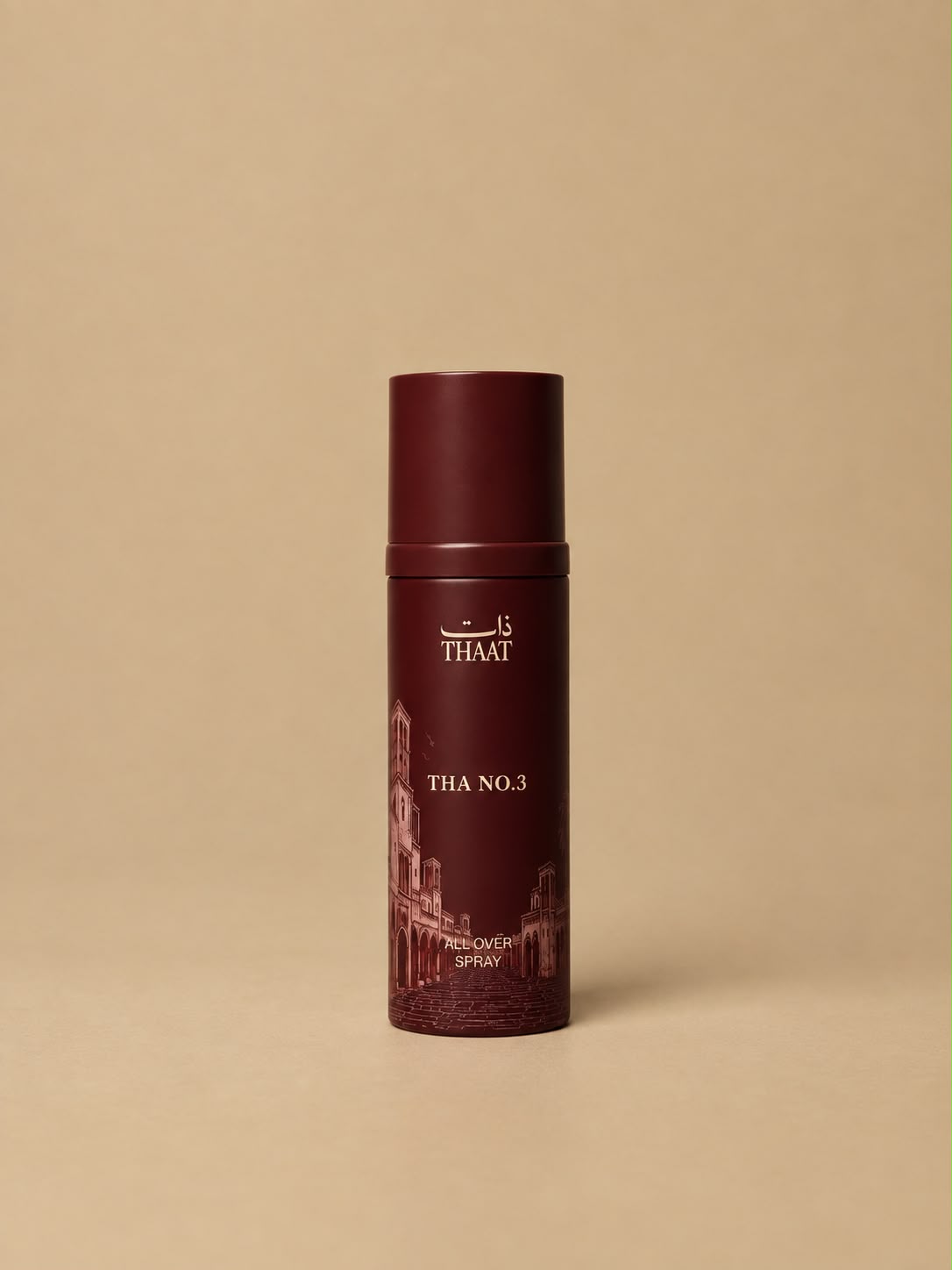 THA NO.3 من ذات — بخاخ All Over Spray بعبوة عنابية ونقوش معمارية — خلفية بيج